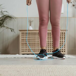 Woman in Black and White Polka Dot Shorts and Black and White Nike Sneakers