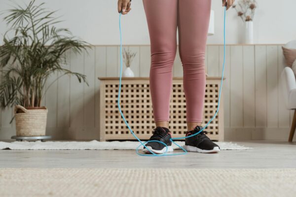Woman in Black and White Polka Dot Shorts and Black and White Nike Sneakers